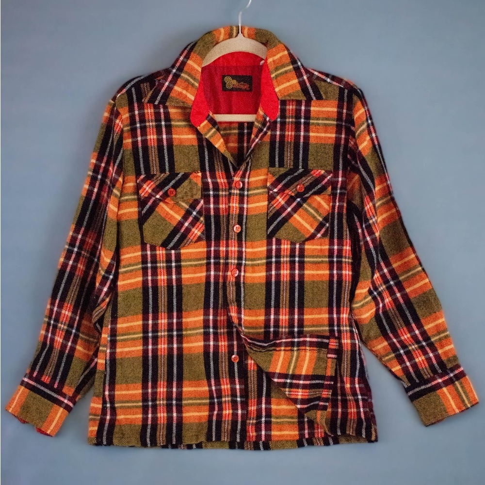 Vintage wool flannel in a vibrant plaid. Orange/red in excellent condition.